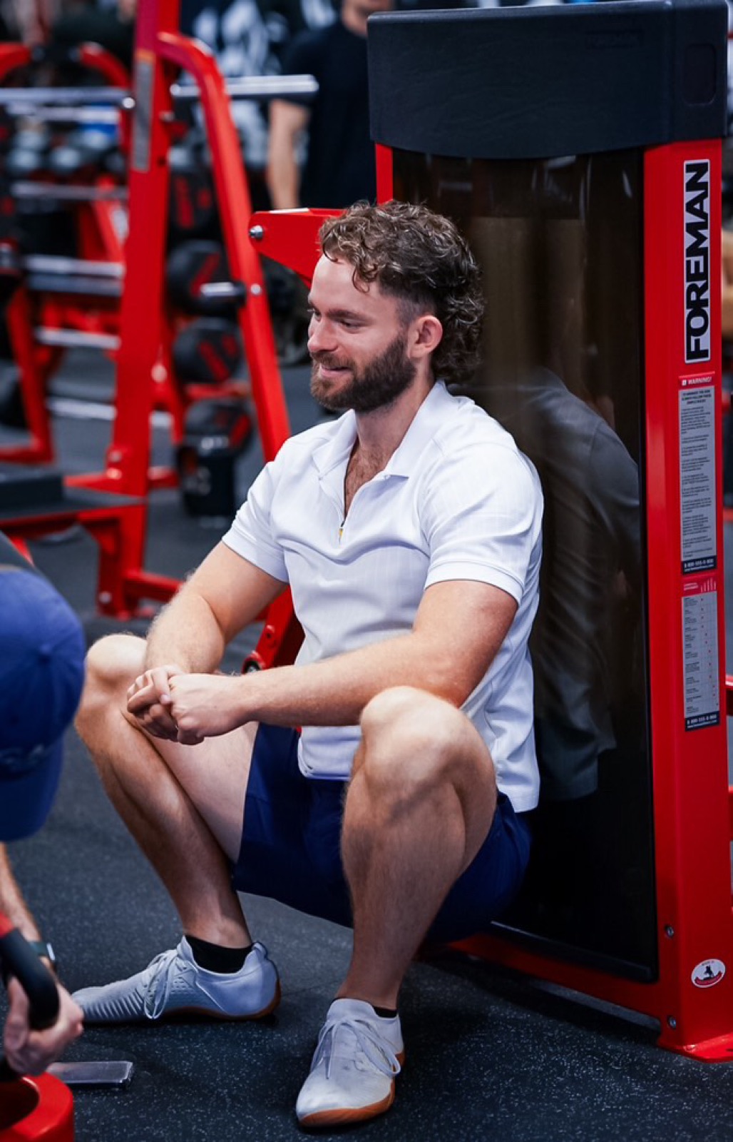 Patrick Bell coaching knee strengthening class at Dallas Knee Club